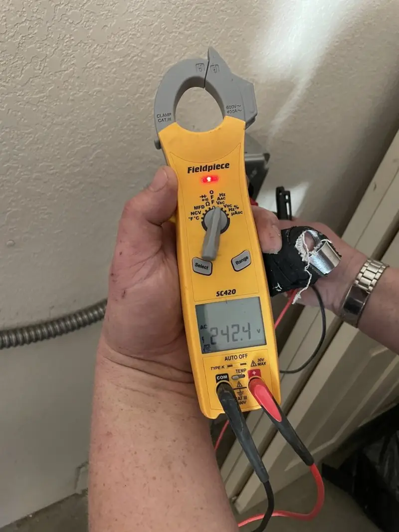 Voltage testing with clamp meter during Electrical Installation Services in Lake Forest